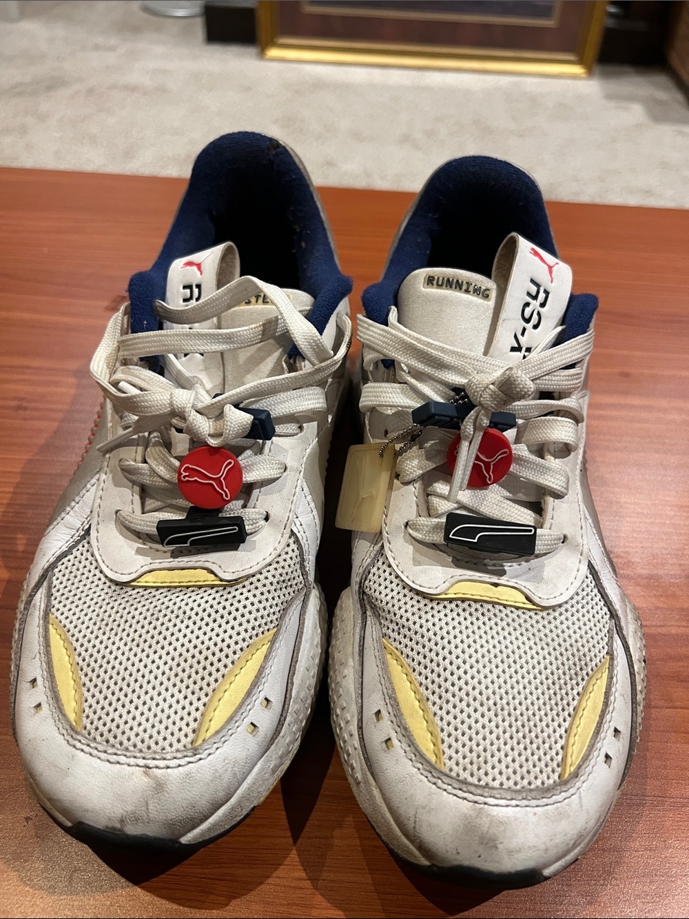 Puma Kids White Mesh Sneakers with Yellow Accents and Navy Collar